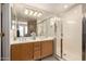 Main bathroom featuring a double vanity and glass-enclosed shower at 15221 N Clubgate Dr # 2012, Scottsdale, AZ 85254