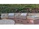 This outdoor kitchen features stainless steel grills, countertop space, and a sink, perfect for outdoor entertaining at 15221 N Clubgate Dr # 2012, Scottsdale, AZ 85254