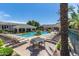 Resort-style pool area with lounge chairs, seating areas and lush landscaping at 15221 N Clubgate Dr # 2012, Scottsdale, AZ 85254