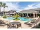 Resort-style pool area with lounge chairs, tables, seating and lush landscaping at 15221 N Clubgate Dr # 2012, Scottsdale, AZ 85254