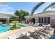 Resort-style pool area with lounge chairs, covered seating and lush landscaping at 15221 N Clubgate Dr # 2012, Scottsdale, AZ 85254