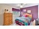 Comfortable bedroom with natural light, ceiling fan, and traditional wooden furniture at 15237 N 61St Dr, Glendale, AZ 85306