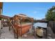 Backyard with a hot tub, gazebo, and view of the pool offers a serene outdoor experience at 15237 N 61St Dr, Glendale, AZ 85306