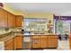 This kitchen is bright with a large window providing natural light over the kitchen sink at 15237 N 61St Dr, Glendale, AZ 85306