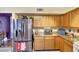 The kitchen features stainless steel appliances and granite countertops at 15237 N 61St Dr, Glendale, AZ 85306