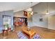 Spacious living room featuring high ceilings, open staircase, and dining area at 15237 N 61St Dr, Glendale, AZ 85306