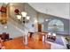Open-concept area with staircase, dining, and living areas, featuring lots of natural light at 15237 N 61St Dr, Glendale, AZ 85306