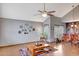 Inviting living room featuring high ceilings and wood-look tile flooring at 15237 N 61St Dr, Glendale, AZ 85306