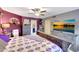 Bright main bedroom includes an entertainment center with a large television at 15237 N 61St Dr, Glendale, AZ 85306