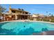 Beautiful backyard with a sparkling blue pool, hot tub, and an extended patio for entertaining guests at 15237 N 61St Dr, Glendale, AZ 85306