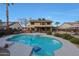 Backyard view featuring a large private pool, hot tub and covered patio, perfect for outdoor entertaining at 15237 N 61St Dr, Glendale, AZ 85306