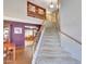 Carpeted staircase leading to an upper level, with a view of dining area at 15237 N 61St Dr, Glendale, AZ 85306