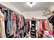 Spacious walk-in closet with ample storage and organization for clothing and accessories at 15237 N 61St Dr, Glendale, AZ 85306