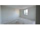 Clean bedroom showcasing a single window that offers a view of the neighborhood and floods the room with light at 15764 W Beryl Ave, Waddell, AZ 85355