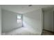 Bright and airy unfinished bedroom with neutral walls, a window, and ample space at 15764 W Beryl Ave, Waddell, AZ 85355