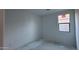 Unfinished bedroom with a window featuring neutral walls and ample natural light at 15764 W Beryl Ave, Waddell, AZ 85355