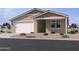 Inviting single-story home featuring a two-car garage and low-maintenance desert landscaping at 15764 W Beryl Ave, Waddell, AZ 85355