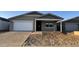 Charming single-story home with a two-car garage and low-maintenance landscaping at 15764 W Beryl Ave, Waddell, AZ 85355