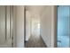 Bright hallway featuring wood-look flooring and neutral walls leading to other rooms at 15764 W Beryl Ave, Waddell, AZ 85355