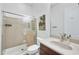 Bathroom with glass shower, neutral tones, and a spacious vanity at 1605 W Molly Ln, Phoenix, AZ 85085