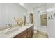 Bathroom featuring a double sink vanity and shower/tub combo at 1605 W Molly Ln, Phoenix, AZ 85085