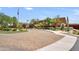 Community center entrance with paved brick drive and beautifully maintained landscaping at 1605 W Molly Ln, Phoenix, AZ 85085