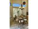 Sunny breakfast nook with four chairs and a glass-top table, enhanced by large windows and a decorative chandelier at 16535 W Fillmore St, Goodyear, AZ 85338