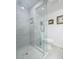 Modern shower with a glass door, sleek tiling, and built-in niche at 1711 E Missouri Ave # 3, Phoenix, AZ 85016