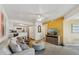 Bright living room featuring a view of the kitchen, ceiling fan, and comfortable seating at 1720 E Thunderbird Rd # 2078, Phoenix, AZ 85022