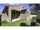 Cozy backyard featuring artificial turf, a covered patio and a low-maintenance landscape at 1783 W Homestead Dr, Chandler, AZ 85286