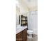 Functional bathroom with a shower/tub combo and a sleek shelving unit at 1783 W Homestead Dr, Chandler, AZ 85286