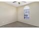 Cozy bedroom with carpet, a ceiling fan and natural light from a window with blinds at 1783 W Homestead Dr, Chandler, AZ 85286