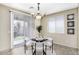 Cozy dining area with a chandelier and access to the outdoor space at 1783 W Homestead Dr, Chandler, AZ 85286