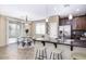 Eat-in kitchen with granite counters, stainless appliances, and eat-in bar at 1783 W Homestead Dr, Chandler, AZ 85286