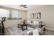 Inviting living room boasts a ceiling fan, area rug, and comfortable seating area at 1783 W Homestead Dr, Chandler, AZ 85286