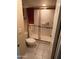 Bathroom featuring a toilet and shower with glass door, creating a functional and modern space at 19224 N 93Rd Ave, Peoria, AZ 85382