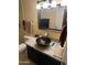 Stylish bathroom featuring a vessel sink, granite countertops, dark wood cabinets, and neutral wall colors at 19224 N 93Rd Ave, Peoria, AZ 85382