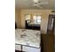 Bedroom featuring a ceiling fan, a closet with mirrored doors, and neutral color scheme at 19224 N 93Rd Ave, Peoria, AZ 85382