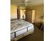Bedroom featuring a neutral color scheme, ceiling fan, storage, and views to the hallway at 19224 N 93Rd Ave, Peoria, AZ 85382
