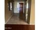 Spacious foyer featuring tile flooring, a dark wood door and neutral-colored walls leading into the living spaces at 19224 N 93Rd Ave, Peoria, AZ 85382