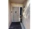 Close-up of front door with security screen, decorative accents, and a side accent light and decorations at 19224 N 93Rd Ave, Peoria, AZ 85382