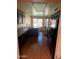 Modern kitchen with dark wood cabinets, granite countertops, and black appliances at 19224 N 93Rd Ave, Peoria, AZ 85382