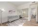 Well-lit bedroom with a plush futon, decorative rug, and mirrored closet, offering a relaxing retreat at 19400 N Westbrook Pkwy # 241, Peoria, AZ 85382