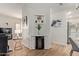 Stylish dining area featuring modern light fixture, white kitchen and charming bar at 19400 N Westbrook Pkwy # 241, Peoria, AZ 85382