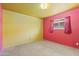 Bright bedroom with two-tone walls, carpet flooring, and a window with curtains at 2015 E Southern Ave # 16, Tempe, AZ 85282