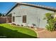 Backyard with artificial turf and mature landscaping along the perimeter of the lot at 2145 E Danbury Rd, Phoenix, AZ 85022