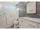 Bright bathroom with white walk-in tub, marbled countertop, and mosaic tile accent wall at 2145 E Danbury Rd, Phoenix, AZ 85022