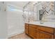 Renovated bathroom features herringbone tile accent wall, tile floors, and walk-in shower at 2145 E Danbury Rd, Phoenix, AZ 85022