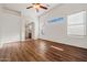 Spacious bedroom boasts wood floors, high ceilings, and archway to the bathroom at 2145 E Danbury Rd, Phoenix, AZ 85022