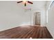 The bedroom features wood floors, high ceilings, and archway to the bathroom at 2145 E Danbury Rd, Phoenix, AZ 85022